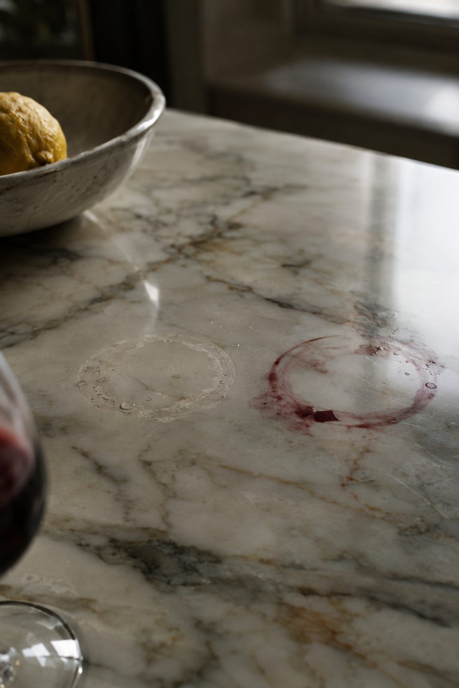 Etch ring and wine stain on unprotected marble countertop